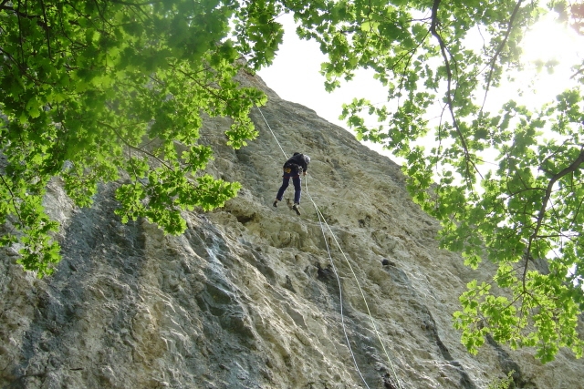 Rappel on a rock wall 